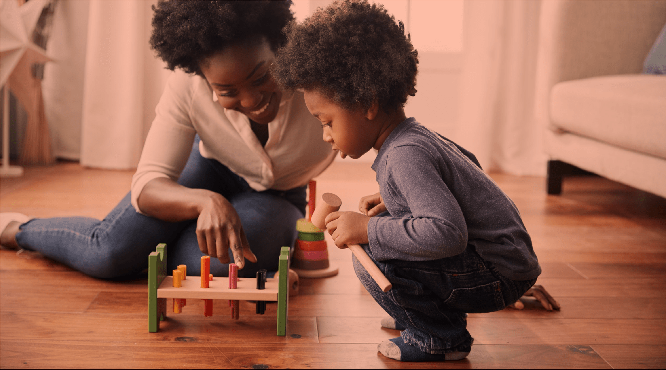 A parent and child playing together